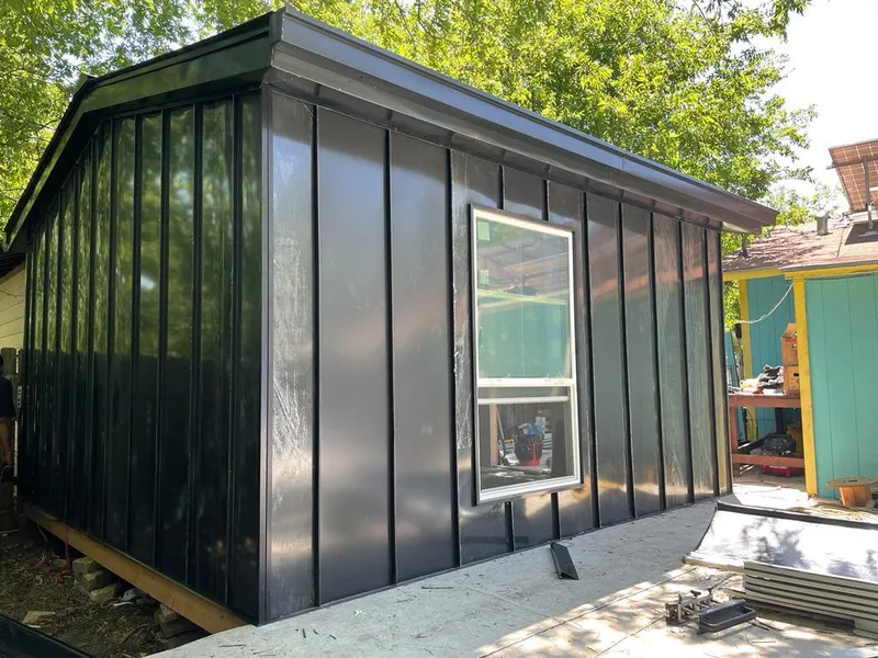 Black standing seam metal wall panels for Roof Inspection in Ypsilanti