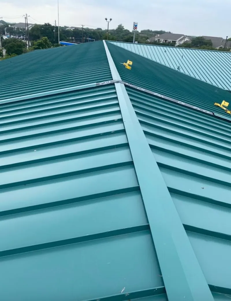 Green commercial metal roof ridge and valley for Metal Roof Repair in Ypsilanti